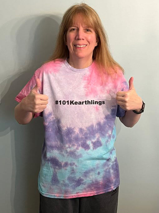 Photo of fan of the month wearing a tie die shirt with the hashtag 101Kearthlings